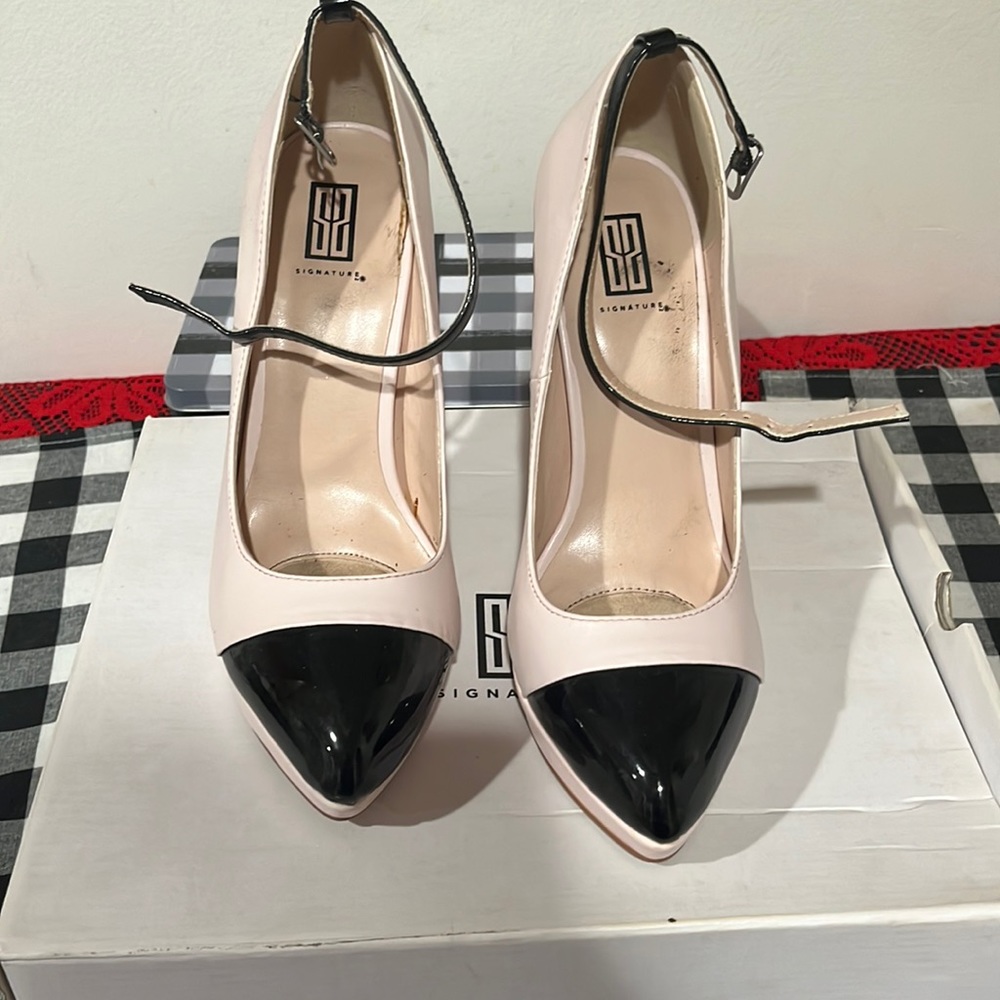 Pink and black heel can be worn with or without the strap worn maybe three times